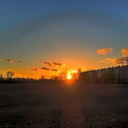 Scenic view of landscape at sunset