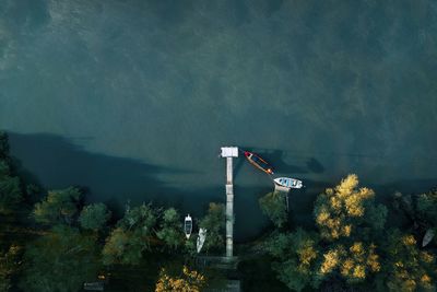 Aerial view of fishing boat by pier