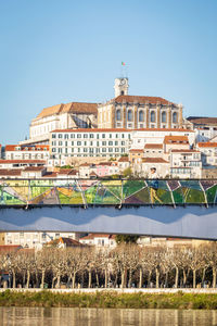 View of buildings against clear blue sky