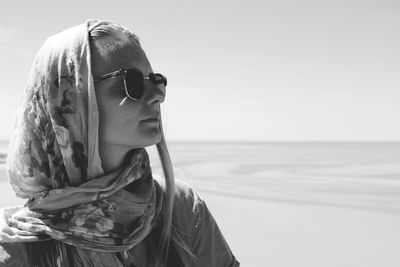 Portrait of woman wearing sunglasses against sky