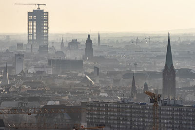 Buildings in city against sky