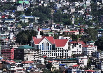 Cityscape of the ao baptist church in kohima city and the surrounding buildings. 