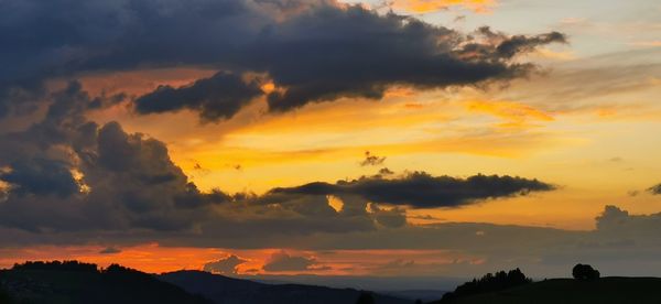 Scenic view of dramatic sky during sunset