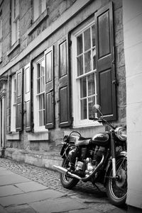 Bicycles on street against building in city