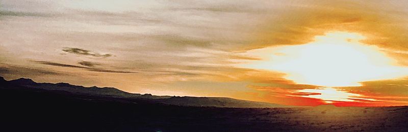 Scenic view of landscape against sky during sunset