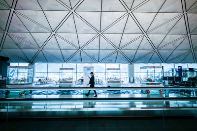 People walking in airport lobby