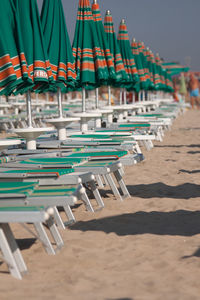 Sunshades and deckchairs on beach