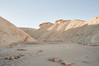 Scenic view of arid landscape against clear sky