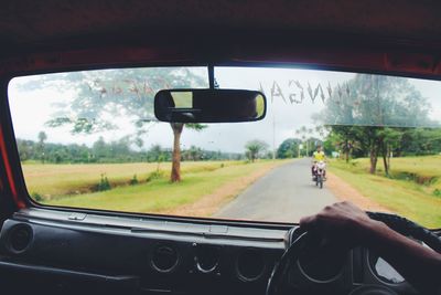 Man driving car on road