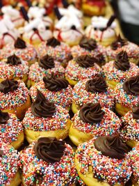 High angle view of donuts at bakery for sale