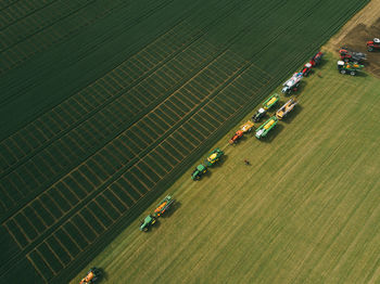 Aerial view of machinery working in agricultural field