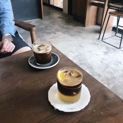 Midsection of coffee cup on table