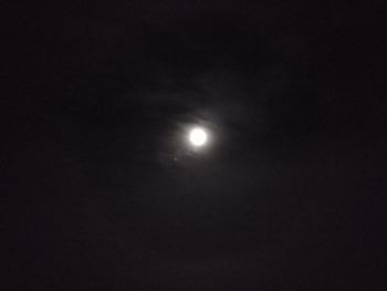 Low angle view of moon against sky at night