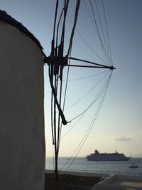 Low angle view of windmill against sky