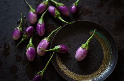 High angle view of eggplants in plate on table