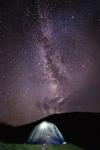 Scenic view of star field against sky at night