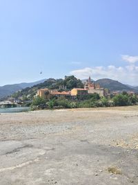 View of mountain range against blue sky