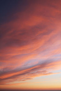 Low angle view of dramatic sky during sunset