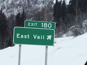 Close-up of road sign on snow