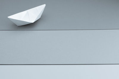 High angle view of paper boat on table