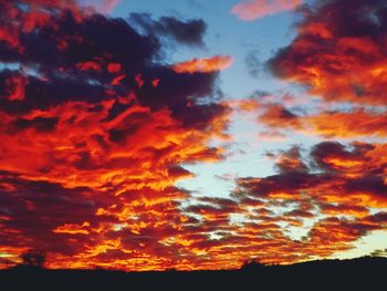 Low angle view of dramatic sky during sunset