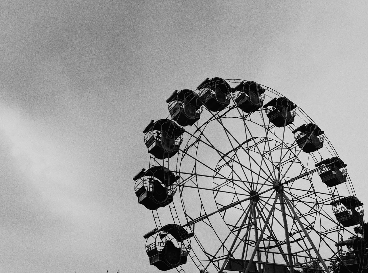 amusement park, amusement park ride, arts culture and entertainment, sky, ferris wheel, low angle view, leisure activity, nature, fairground, cloud - sky, day, outdoors, circle, no people, metal, enjoyment, shape, geometric shape, large, fun