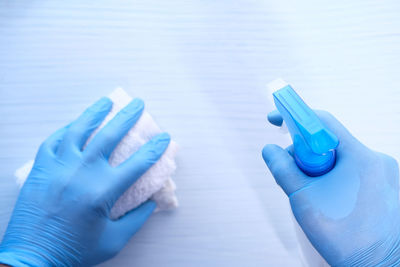 Close-up of human hand holding plastic bag