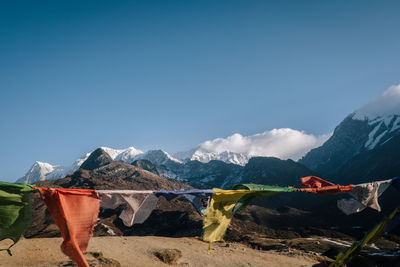 Scenic view of mountains against blue sky
