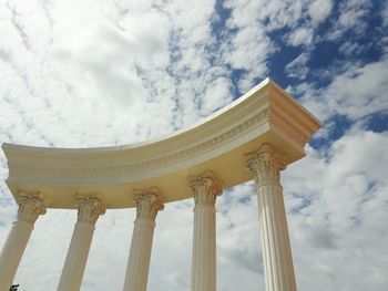 Low angle view of historical building against cloudy sky