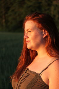 Portrait of young woman looking away