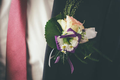Close-up of flower bouquet of groom 