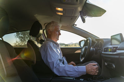 Senior man driving a car