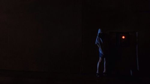 Woman standing at night
