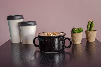 Close-up of coffee cup on table