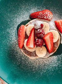 High angle view of strawberries in container