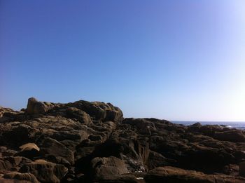 Scenic view of rock formation against clear blue sky