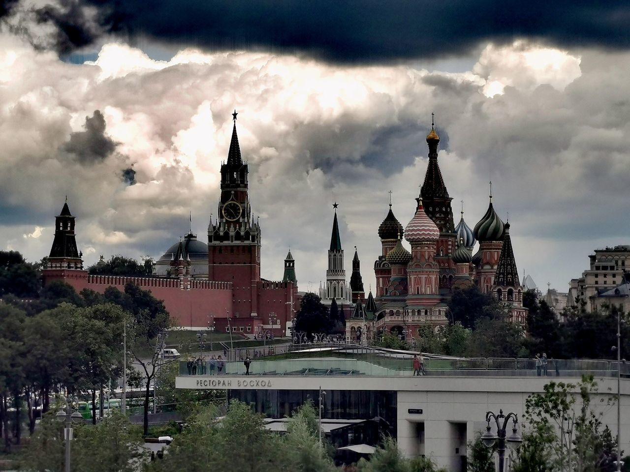 BUILDINGS AGAINST CLOUDY SKY