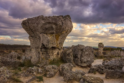 View of rock formation against sky during sunset