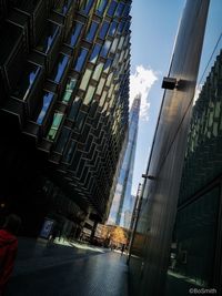 Modern buildings in city against sky