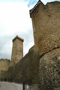 Low angle view of old building against sky