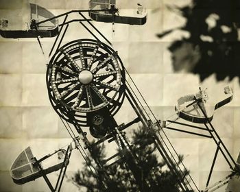 Low angle view of ferris wheel against sky