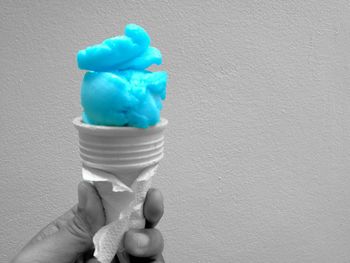 Close-up of hand holding ice cream