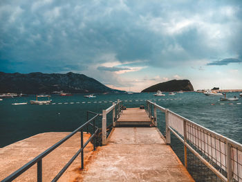 Pier over sea against sky