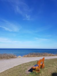 Scenic view of sea against blue sky