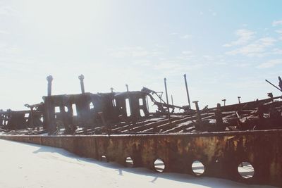 Scenic view of beach against sky during winter