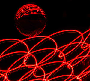 Close-up of light painting against black background