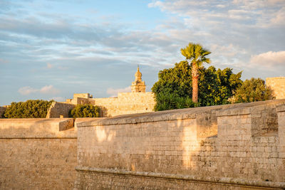 View of temple against cloudy sky