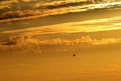 Low angle view of cloudy sky at sunset