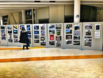 Woman standing on railroad station platform