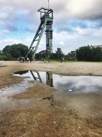 View of people on water against sky